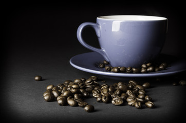 Cup of coffee with coffee beans