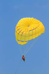 Parachute surfer being hauled by a motorboat