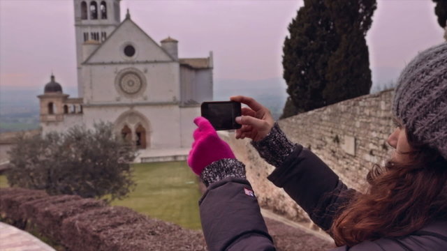 Tourist taking pictures with smartphone