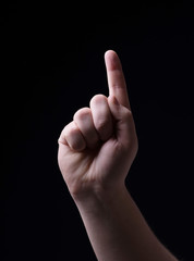 One finger on a black background