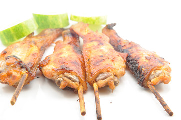 Grilled chicken wings on white dish
