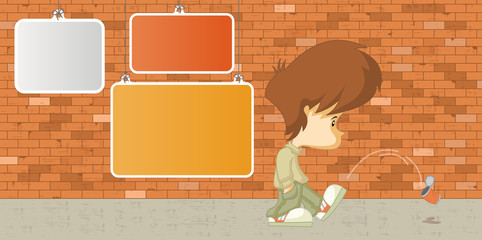 Sad boy kicking a can