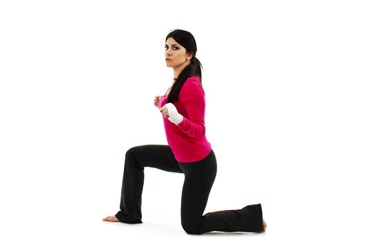 Beautiful fitness girl with white boxing bandage on hands