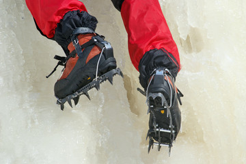 Ice climbing crampons in use closeup
