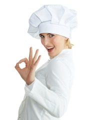 Female chef baker or cook shows ok