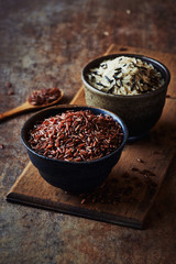 Different types of rice in ceramic bowls