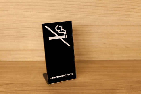 No Smoking sign on wooden table