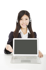 Young  smiling businesswoman with headset and laptop isolated on