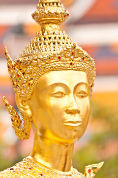 golden face of fairy statue in thailand