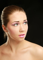 Woman with exotic style makeup, isolated on black background