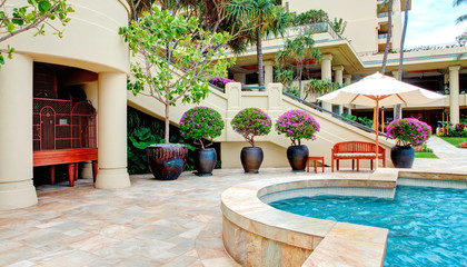 Tropical pool with luxury resort court yard.