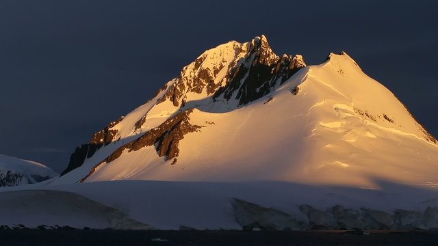 snow mountain sunset at antarctica