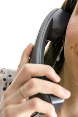 Woman holding a telephone handset