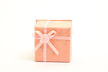 Orange gift box with pink ribbon