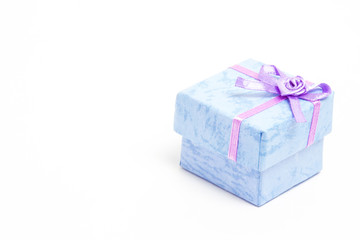 Blue gift box with purple ribbon