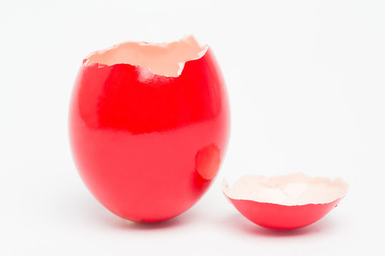 Red painted egg with its top broken off