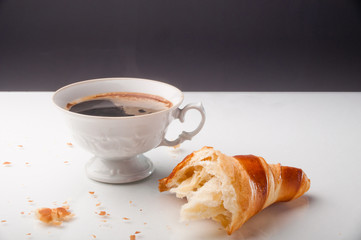 Croissant and a cup of delicious coffee
