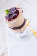 vanilla pudding with cherry and biscuit
