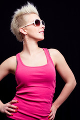 blonde girl in pink top and white glasses