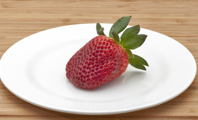 strawberry on white plate