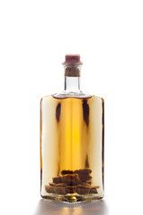 bottle of homemade liquor isolated on white background