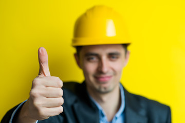 A man in a helmet shows all ok, super