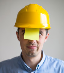 The builder in a helmet and stickers