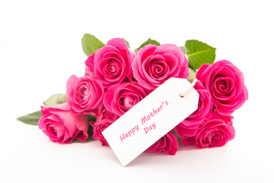 Close up of a beautiful bouquet of pink roses with a happy mothe