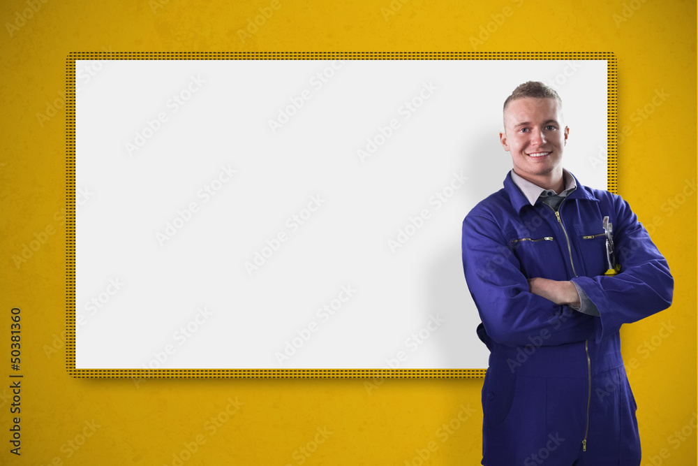 Poster mechanic standing in front of a white screen on yellow backgroun