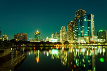 City downtown at night with reflection of skyline,Emerald green - 50382107
