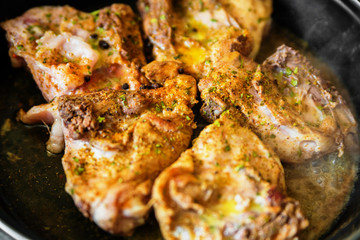 Chicken on frying pan
