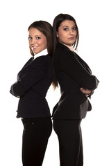 Two business women posing on white background