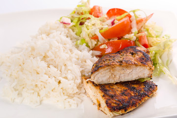 Roasted chicken breast with salad and rice