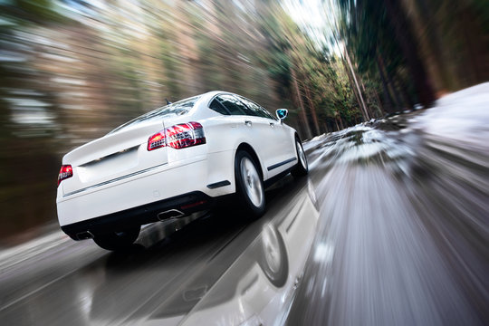 White Moving Car In The Forest