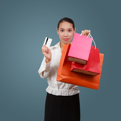 Beautiful shopping woman holding shopping bags.