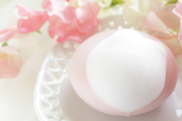 Pink facial soap and flower for beauty image