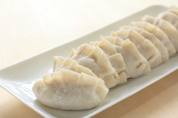 Fototapeta na wymiar prepared chinese dumpling, gyoza on dish