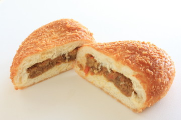  japanese bakery, curry bread cut half on white background