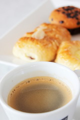 coffee cup  muffin and danish