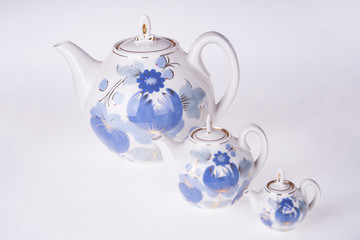 three porcelain teapots