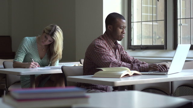 African American man studying, dolly shot