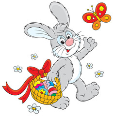 Easter Bunny carries a basket of eggs