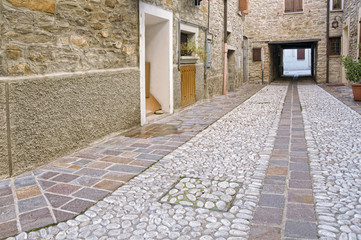 Renovated medieval path ending in a tunnel