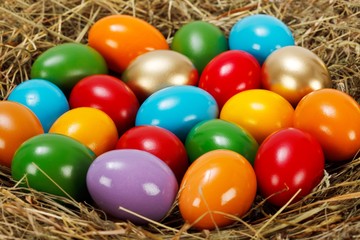 Fototapeta na wymiar Close view of colorful Easter eggs in nest