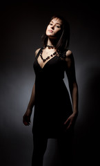 Fototapeta na wymiar Beautiful girl in black dress