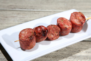 pork sausage on a skewer