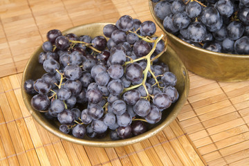 Black grape in copper bowl