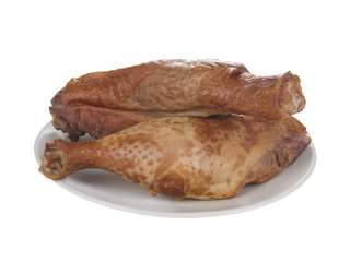 smoked chicken legs in plate, isolated on white