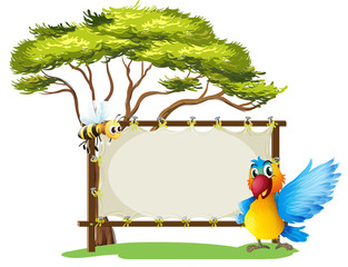An empty framed banner with a parrot and a a bee © GraphicsRF