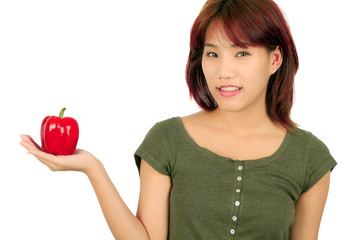 Young asian woman with paprika on white